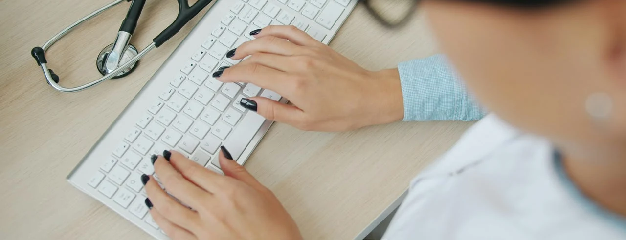 A practice team member using Medvexis at the front desk.